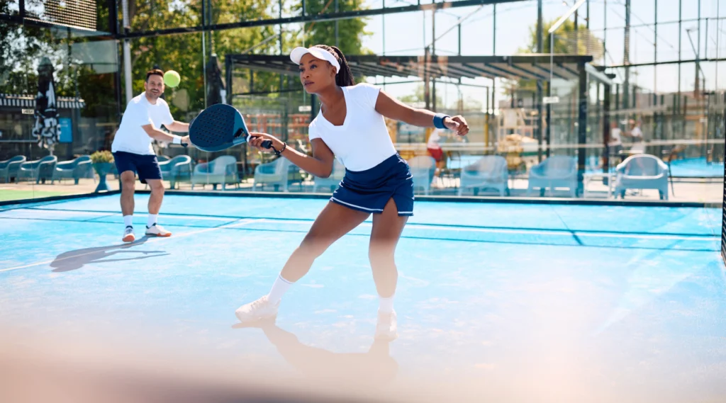 playing padel in a court